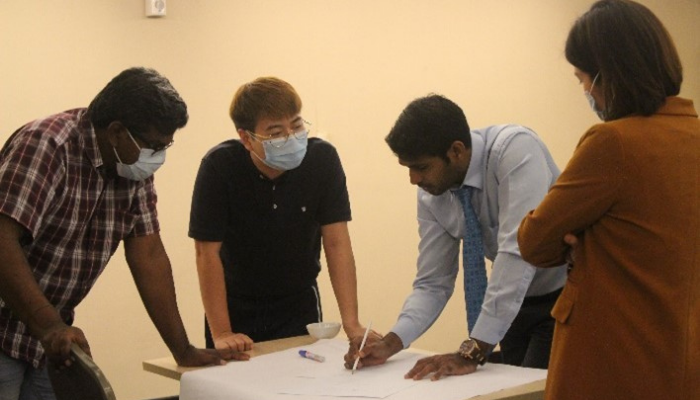 Six sigma coach teaching students